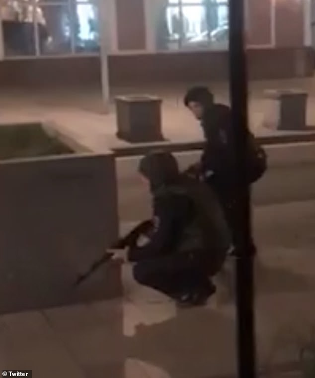 Terrified people have shared footage of police officers during the shooting on social media