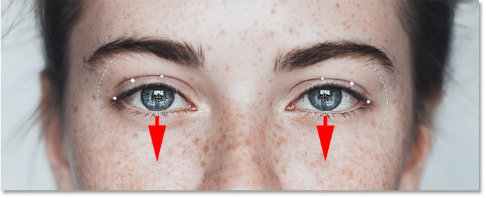 Lowering the eyes to enhance the smile in Photoshop