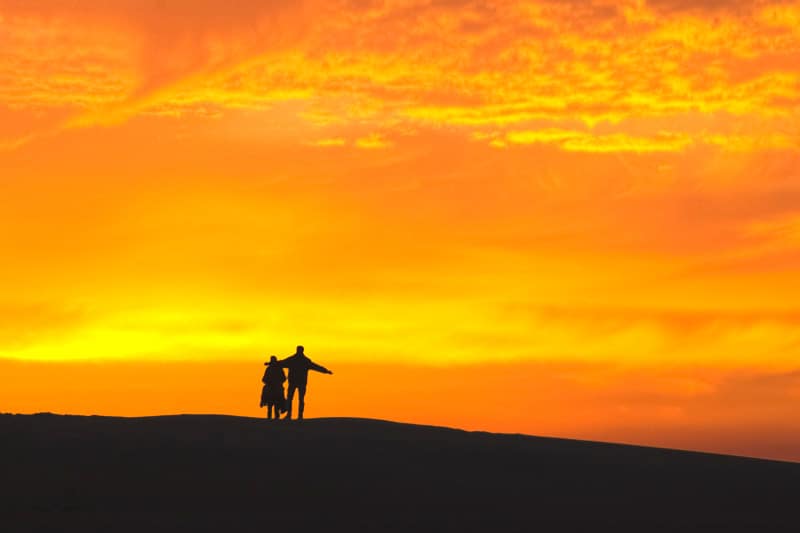 Silhouette of a couple during sunrise