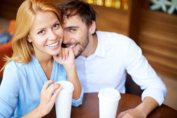 Portrait of young couple sitting by table in cafe - What a Scorpio Man Does To Show You He Loves You